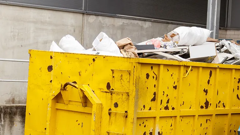 A large yellow roll on/off skip