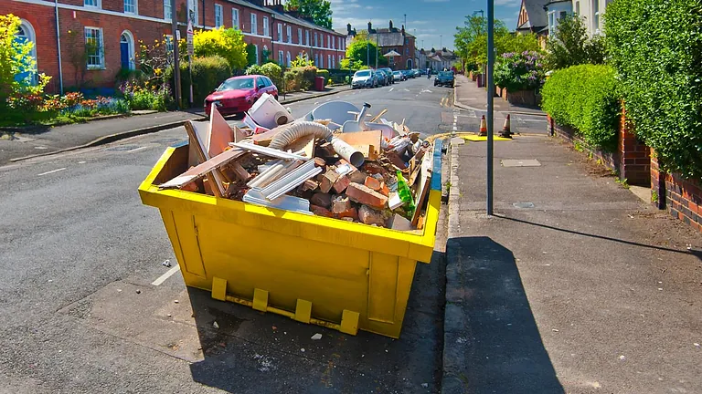 A skip outside a customer home
